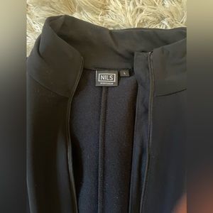 NILS Women’s Black Ski Suit. This is not waterproof and is a polyester onesie